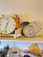 All four clocks on shelf