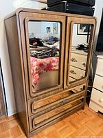 Front view showing mirrored doors and drawers