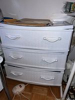 Full view of white plastic 3-drawer unit with faux wicker finish