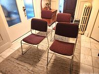 Four burgundy tweed chairs on chrome frames