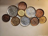 Full view of wall art showing all metal discs