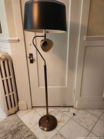 Full view of lamp front, drum shade, side spotlight, base