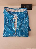 Folded shirt showing front pattern and snaps