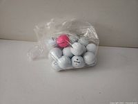 Bag of assorted golf balls