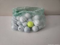 Bag containing 25 assorted golf balls