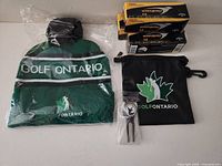 All items: toque, pouch, divot tool, three sleeves of Callaway Warbird 2.0 golf balls