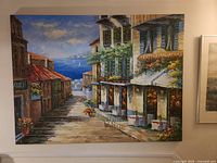 Full view of framed acrylic painting depicting trattoria street scene