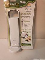 Front view of sealed OttLite HD 30 LED Task Light package