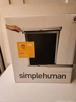 Front of box showing simplehuman 30 L pull-out can