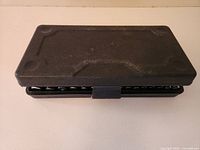 Closed black plastic socket case