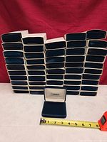 Stack of 50 navy Angelo jewellery boxes
