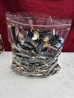 Ziplock bag filled with numerous wristwatches