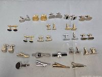 Group shot of all cufflinks and tie clips