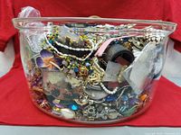 Overall view of mixed jewellery packed in glass bowl