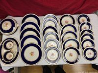 Overview of entire 32-piece dinnerware set laid out