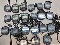Full group of approximately 22 stopwatches spread out