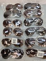 Overview of eleven plastic-wrapped Turbo sunglasses pairs