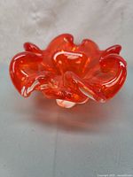 Top view showing ruffled orange glass bowl