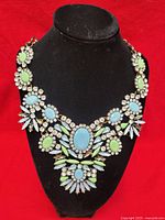 Front view of entire statement necklace on display bust
