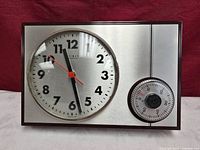 Full view of rectangular Weimar Quartz wall clock showing clock face and timer