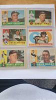 Front view of all six 1960 Topps cards in protectors