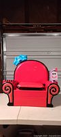 Front view of red Blue's Clues plastic chair