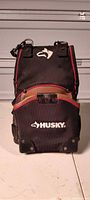 Front view of Husky black and red 2-pocket framer tool pouch standing upright