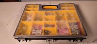 Closed organizer toolbox showing clear lid, yellow compartments, black base