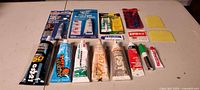 Full lot overview of all adhesive and sealant items on table