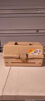 Closed tan Fenwick 1060 tackle box front view