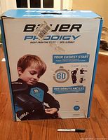 Retail box front showing Bauer Prodigy branding and youth size information