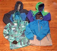 All four jackets laid out showing fronts