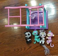 Top view of jungle gym and the four Fingerlings toys