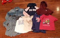 All eight tops displayed on floor