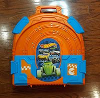 closed orange carry case with Hot Wheels logo