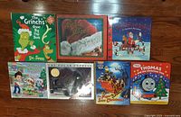 All seven Christmas books laid out