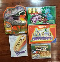 Group shot of five boxed children's games and puzzle