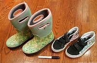 Overview of both pairs: Bogs boots and Vans sneakers with marker for scale