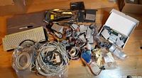 Overview of lot with keyboards, cables, cards, drive