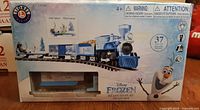 Front of boxed Lionel Disney Frozen Ready-to-Play Train Set showing artwork and contents