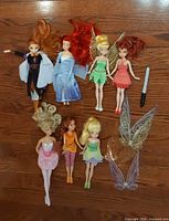 All seven dolls, two wing sets and scale marker on floor