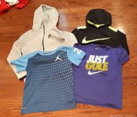 Group shot of both hoodies and both tees