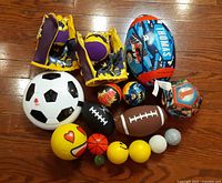 Group shot of all balls and mitts