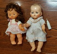 Both dolls side by side showing size, outfits, hair and accessory