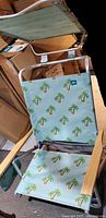 Overall view of Bliss beach chair with canopy and palm tree print