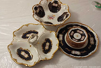 Entire 11-piece set showing bowl, divided dish, platter and stacked plates