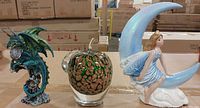 Front view of all three items: dragon, glass apple, moon fairy