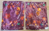 Front view of packaged wine/burgundy maple leaf scarf