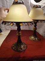 Front view of both PartyLite Paris Retro tealight lamps with shades on