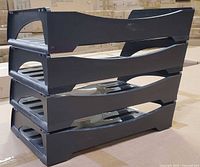 Three trays stacked showing side profile and stackability